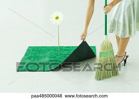 Woman sweeping under artificial turf rug, waist down View Large Photo Image Stock Photo - Woman sweeping under artificial turf rug, waist down. Fotosearch