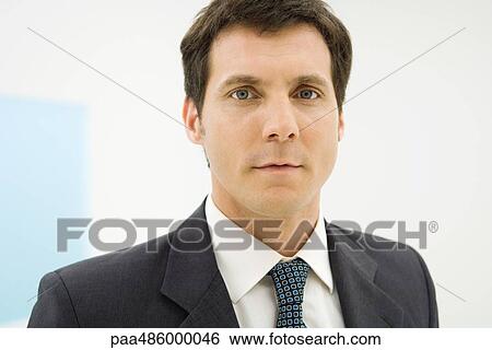 Businessman looking at camera, portrait View Large Photo Image Stock Photograph - Businessman looking at camera, portrait. Fotosearch