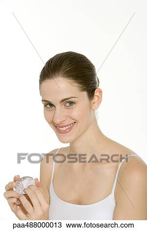Woman using nail brush, smiling at camera View Large Photo Image Stock Image - Woman using nail brush, smiling at camera. Fotosearch