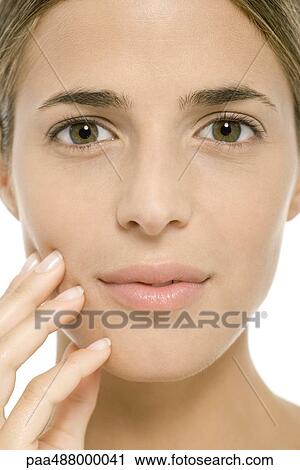 Woman's face, fingers on cheek, close-up View Large Photo Image Stock Image - Woman's face, fingers on cheek, close-up. Fotosearch