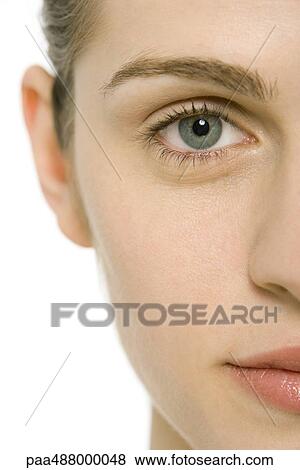 Woman's face, looking at camera, cropped view, close-up View Large Photo Image Stock Photo - Woman's face, looking at camera, cropped view, close-up. Fotosearch
