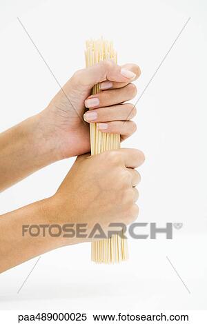 Woman holding dried pasta, cropped view of hands View Large Photo Image Stock Photography - Woman holding dried pasta, cropped view of hands. Fotosearch