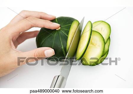 Woman slicing squash with knife, cropped view of hand View Large Photo Image Stock Image - Woman slicing squash with knife, cropped view of hand. Fotosearch