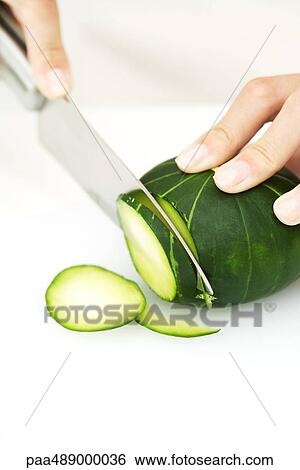 Woman slicing winter squash with knife, cropped view of hands View Large Photo Image Stock Photograph - Woman slicing winter squash with knife, cropped view of hands. Fotosearch