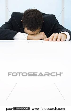 Businessman with head down on table View Large Photo Image Stock Photograph - Businessman with head down on table. Fotosearch