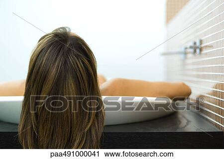 Woman in bathtub, view of back of head, close-up View Large Photo Image Stock Image - Woman in bathtub, view of back of head, close-up. Fotosearch