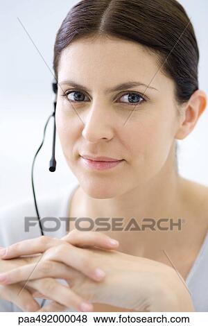 Attentive customer service representative, smiling at camera, portrait View Large Photo Image Stock Photo - Attentive customer service representative, smiling at camera, portrait. Fotosearch