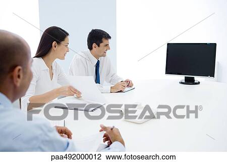 Group of executives having teleconference View Large Photo Image Stock Image - Group of executives having teleconference. Fotosearch