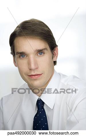 Young businessman, looking at camera, portrait View Large Photo Image Stock Image - Young businessman, looking at camera, portrait. Fotosearch
