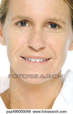 Mature woman smiling at camera, portrait View Large Photo Image Stock Photo - Mature woman smiling at camera, portrait. Fotosearch
