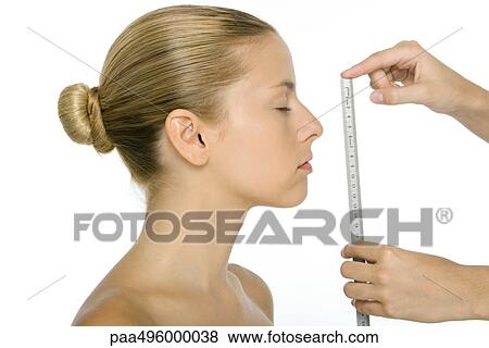 Woman in profile, face being measured with ruler View Large Photo Image Stock Photo - Woman in profile, face being measured with ruler. Fotosearch