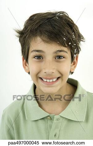 Boy with confetti in his hair, smiling, portrait View Large Photo Image Stock Photography - Boy with confetti in his hair, smiling, portrait. Fotosearch