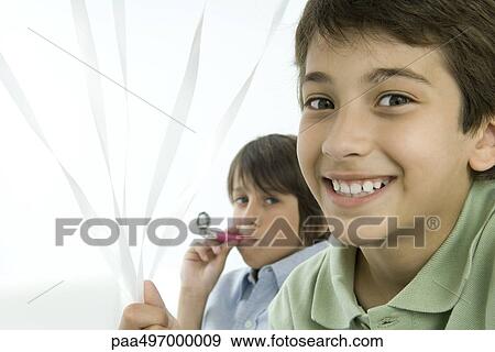Boys at a party, smiling at camera, portrait View Large Photo Image Stock Photo - Boys at a party, smiling at camera, portrait. Fotosearch