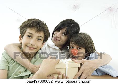 Mother with arms around her two sons, one wearing clown's nose, portrait View Large Photo Image Stock Image - Mother with arms around her two sons, one wearing clown's nose, portrait. Fotosearch