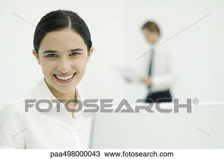 Female professional smiling at camera, portrait View Large Photo Image Stock Image - Female professional smiling at camera, portrait. Fotosearch