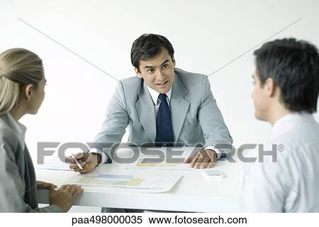 Professional explaining blueprints to clients View Large Photo Image Stock Photography - Professional explaining blueprints to clients. Fotosearch
