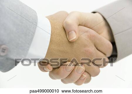 Business partners shaking hands, cropped view, close-up View Large Photo Image Stock Image - Business partners shaking hands, cropped view, close-up. Fotosearch
