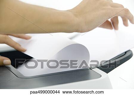 Hands arranging paper in printer, cropped View Large Photo Image Picture - Hands arranging paper in printer, cropped. Fotosearch