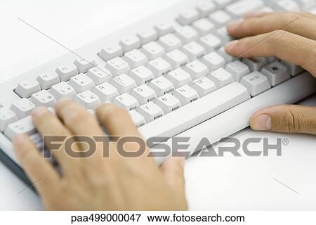 Stock Photo - Hands typing on computer keyboard. Fotosearch