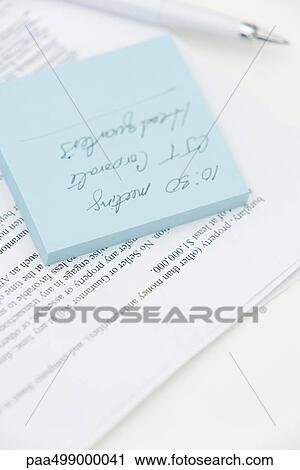 Message written on adhesive note and document, close-up View Large Photo Image Stock Image - Message written on adhesive note and document, close-up. Fotosearch