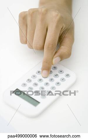 Person using calculator, cropped view of hand View Large Photo Image Stock Photograph - Person using calculator, cropped view of hand. Fotosearch