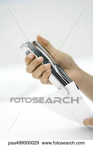 Person using stapler, cropped view of hands View Large Photo Image Stock Photo - Person using stapler, cropped view of hands. Fotosearch