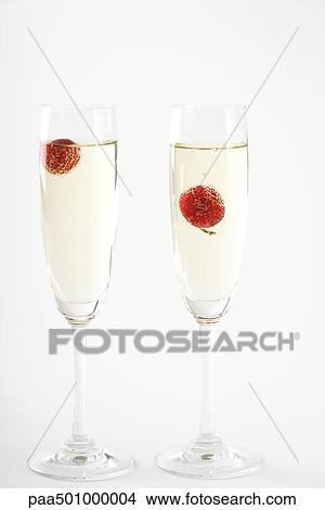 Champagne with cherries in glasses View Large Photo Image Picture - Champagne with cherries in glasses. Fotosearch