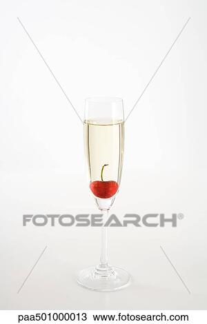 Cherry floating in glass of champagne View Large Photo Image Stock Image - Cherry floating in glass of champagne. Fotosearch