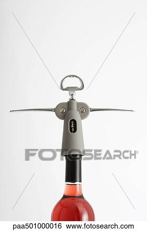Corkscrew in wine bottle, close-up View Large Photo Image Stock Photograph - Corkscrew in wine bottle, close-up. Fotosearch