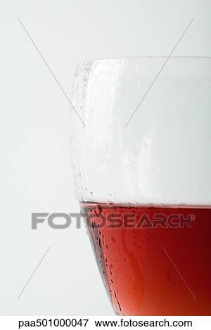 Glass of chilled rose wine, close-up View Large Photo Image Stock Photo - Glass of chilled rose wine, close-up. Fotosearch