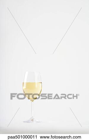 Glass of white wine View Large Photo Image Stock Image - Glass of white wine. Fotosearch