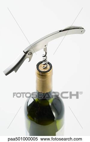 Uncorking wine bottle, close-up View Large Photo Image Stock Photography - Uncorking wine bottle, close-up. Fotosearch