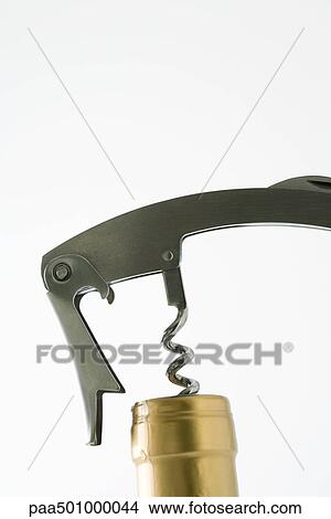 Picture - Uncorking wine bottle, cropped. Fotosearch