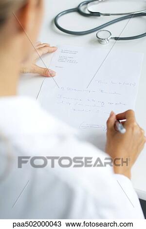 Doctor writing prescription, over the shoulder view, cropped View Large Photo Image Stock Image - Doctor writing prescription, over the shoulder view, cropped. Fotosearch