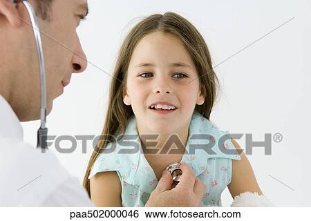 Pediatrician listening to girl's heart with stethoscope View Large Photo Image Stock Photograph - Pediatrician listening to girl's heart with stethoscope. Fotosearch