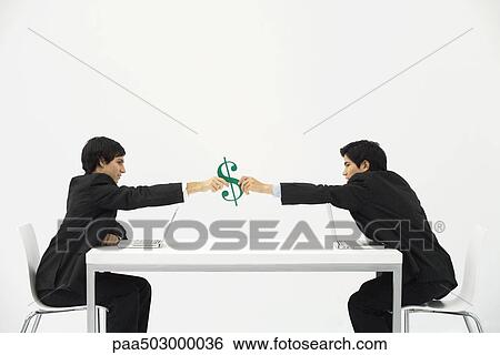 Stock Photograph - Businessmen sitting face to face at table, each reaching to hold dollar sign. Fotosearch