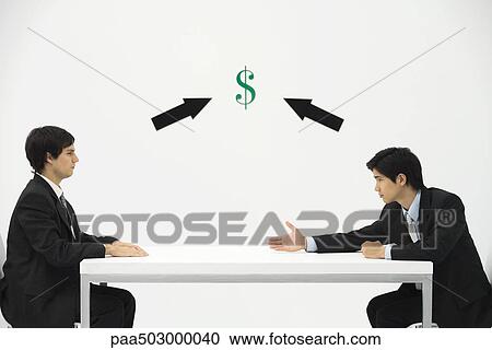 Two businessmen face to face, one reaching to offer his hand, dollar sign and arrows between them View Large Photo Image Stock Image - Two businessmen face to face, one reaching to offer his hand, dollar sign and arrows between them. Fotosearch