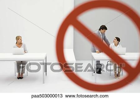 Warning sign across chatting male and female office workers, female colleague watching View Large Photo Image Stock Image - Warning sign across chatting male and female office workers, female colleague watching. Fotosearch