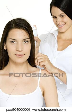 Woman getting her hair done, looking at camera View Large Photo Image Stock Photograph - Woman getting her hair done, looking at camera. Fotosearch