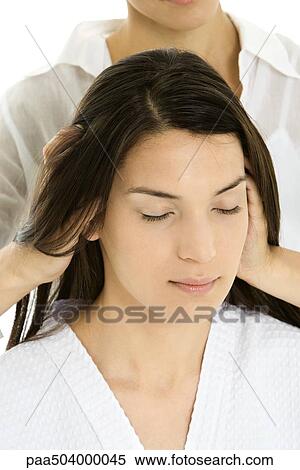 Woman receiving head massage, hands in her hair, relaxing with her eyes closed View Large Photo Image Stock Photography - Woman receiving head massage, hands in her hair, relaxing with her eyes closed. Fotosearch