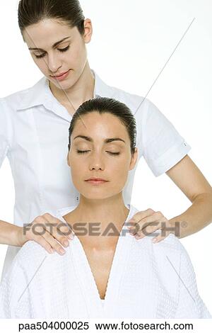 Woman receiving shoulder massage, relaxing with eyes closed View Large Photo Image Stock Photography - Woman receiving shoulder massage, relaxing with eyes closed. Fotosearch