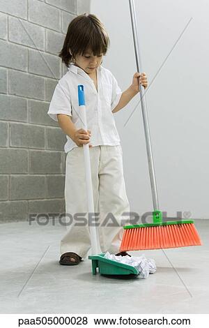 Stock Photo - Little boy sweeping the floor. Fotosearch