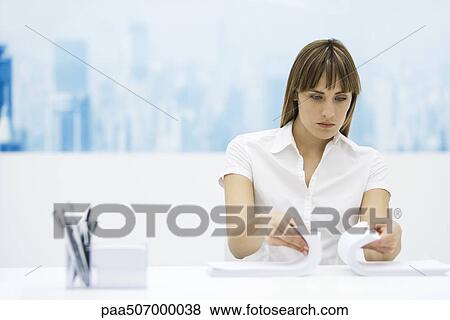 Woman shuffling two stacks of paper together, sitting at desk View Large Photo Image Stock Photo - Woman shuffling two stacks of paper together, sitting at desk. Fotosearch