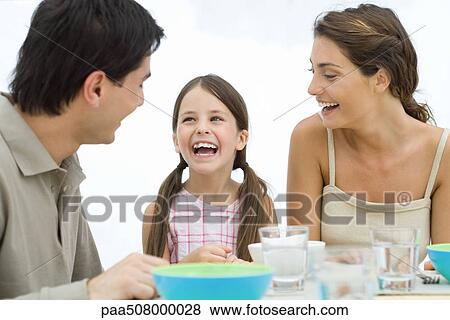 Family looking at each other and laughing View Large Photo Image Stock Photo - Family looking at each other and laughing. Fotosearch