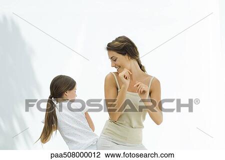 Mother dancing with daughter, bumping hips together View Large Photo Image Stock Image - Mother dancing with daughter, bumping hips together. Fotosearch