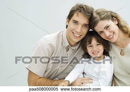 Young parents with little boy, smiling at camera, portrait View Large Photo Image Stock Photography - Young parents with little boy, smiling at camera, portrait. Fotosearch