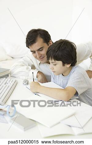Father helping son with his homework View Large Photo Image Stock Photography - Father helping son with his homework. Fotosearch