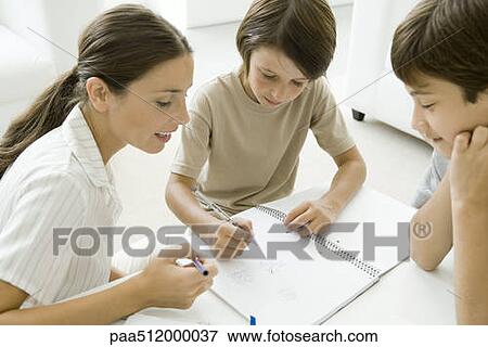 Stock Photo - Mother and two sons playing tic-tac-toe together. Fotosearch
