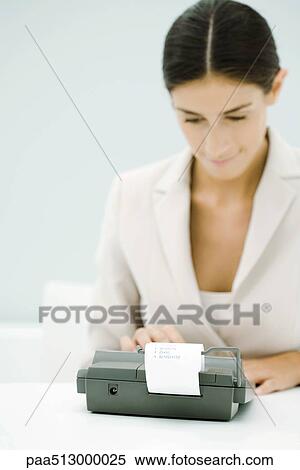 Female accountant using adding machine, looking down View Large Photo Image Stock Photography - Female accountant using adding machine, looking down. Fotosearch