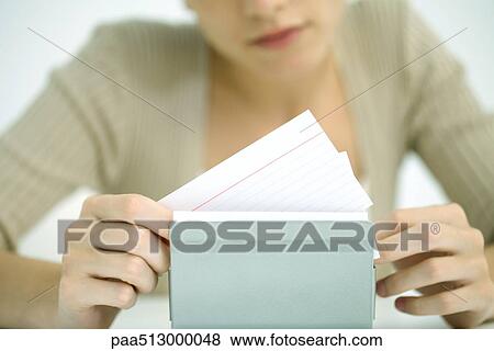 Woman flipping through card file, cropped view View Large Photo Image Stock Photo - Woman flipping through card file, cropped view. Fotosearch